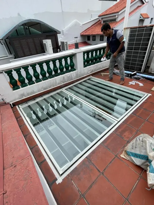 Detail of glass panel seam and silicone weatherproofing