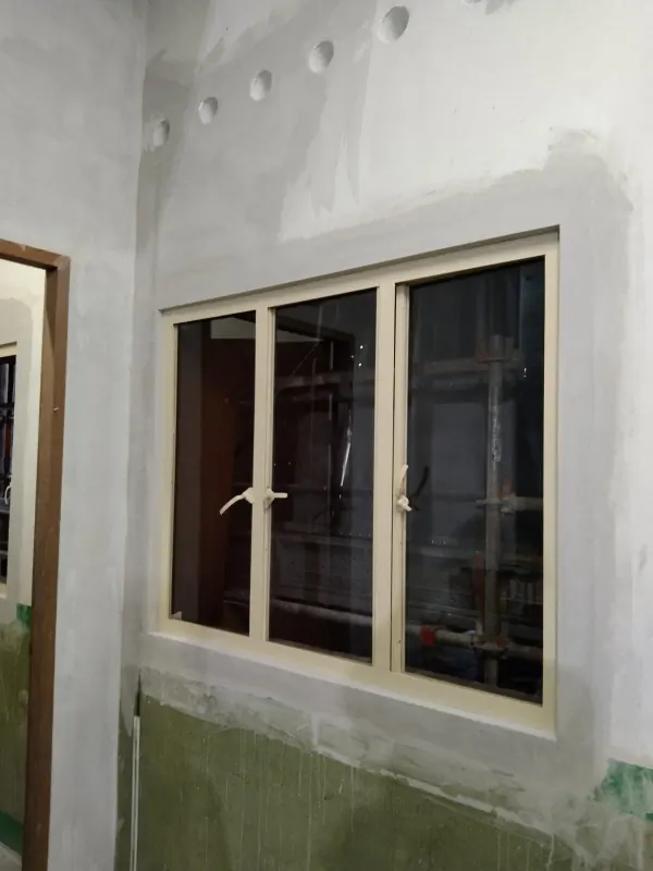 Interior view through the heritage metal glass frame showing colonial-era proportional detailing