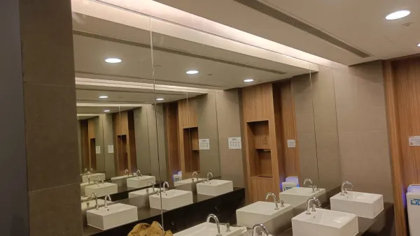 Wide view of completed mirror wall in restroom